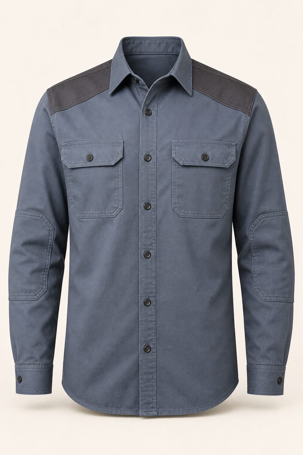 Camisa Industrial Uspallata en azul acero con canesú de hombros en contraste y codos reforzados, vista frontal sobre fondo neutro.